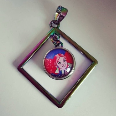 DodaDolls Jewelry pendant with a Superstar Barbie illustration in a rainbow frame